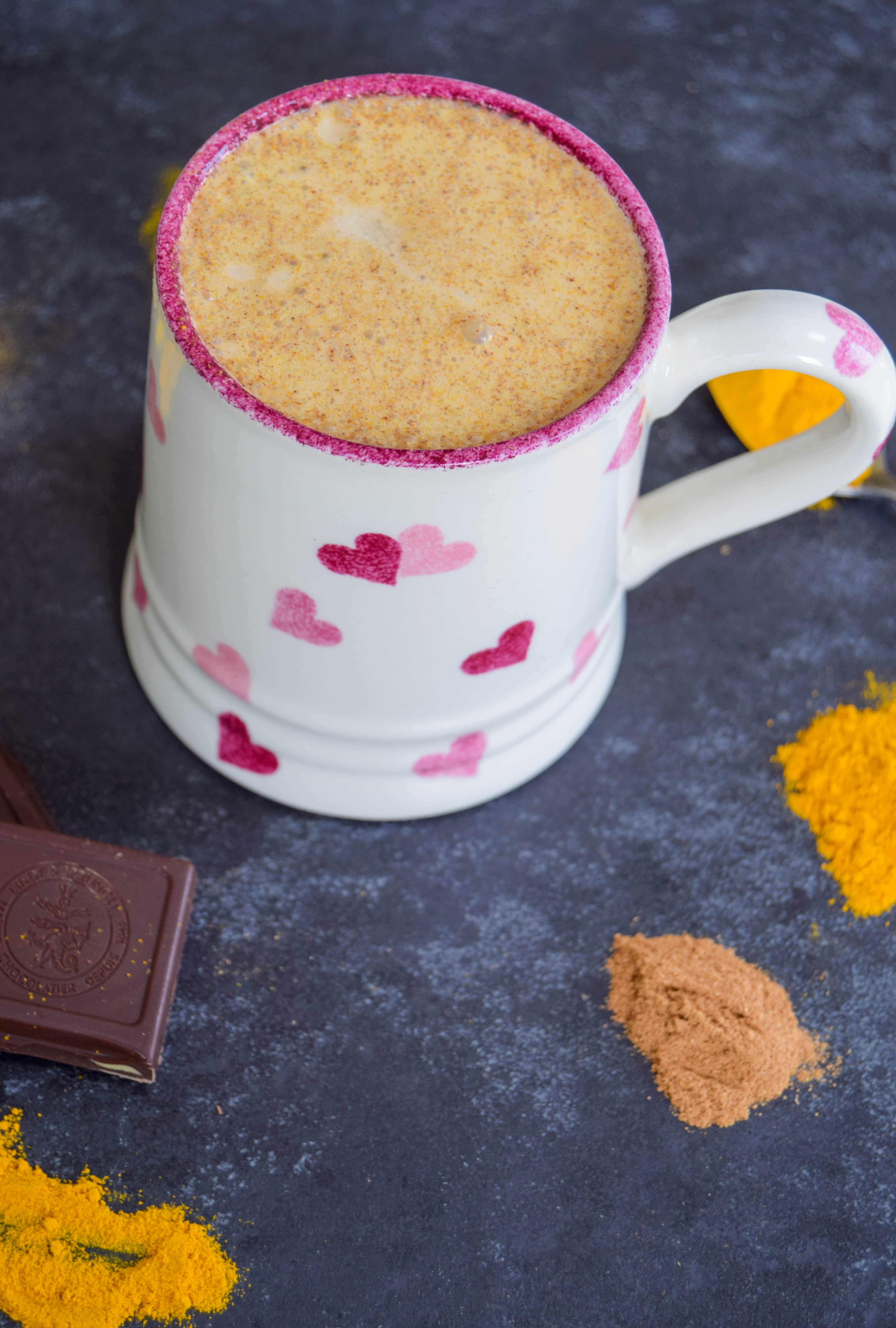 A comforting vegan golden milk hot chocolate made with turmeric and cinnamon - the perfect way to get some hygge into your life!
