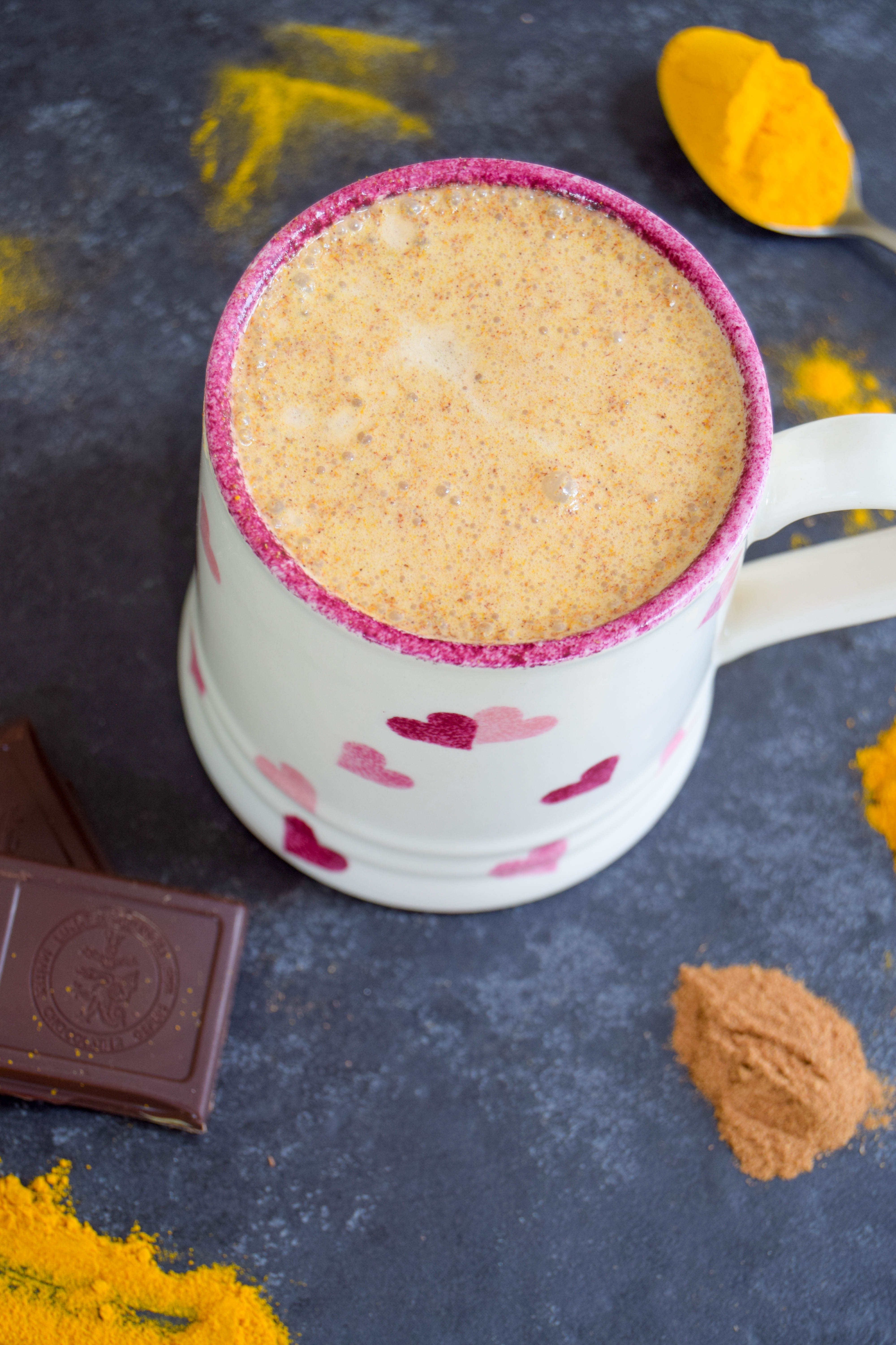 A comforting vegan golden milk hot chocolate made with turmeric and cinnamon - the perfect way to get some hygge into your life!