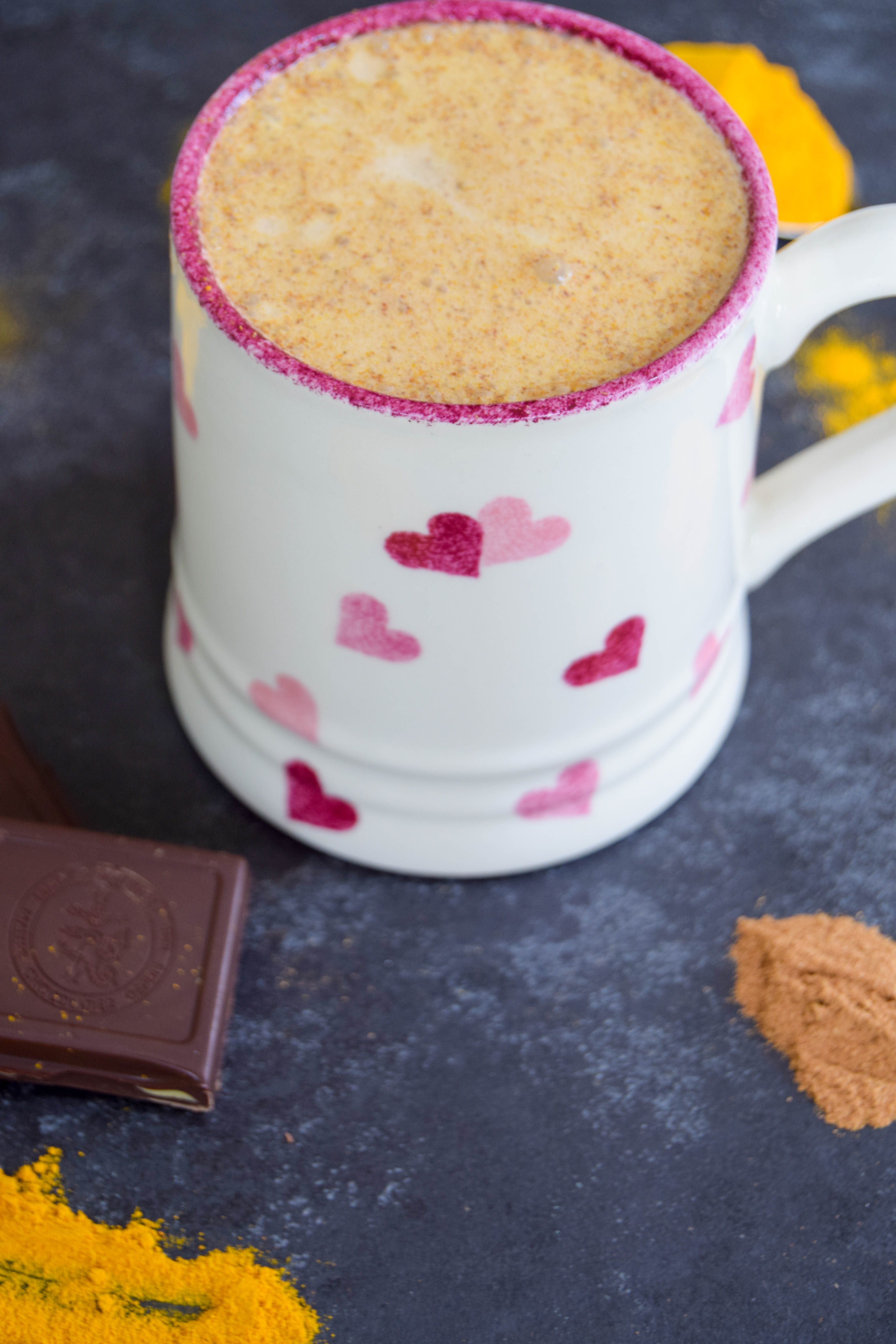 A comforting vegan golden milk hot chocolate made with turmeric and cinnamon - the perfect way to get some hygge into your life!