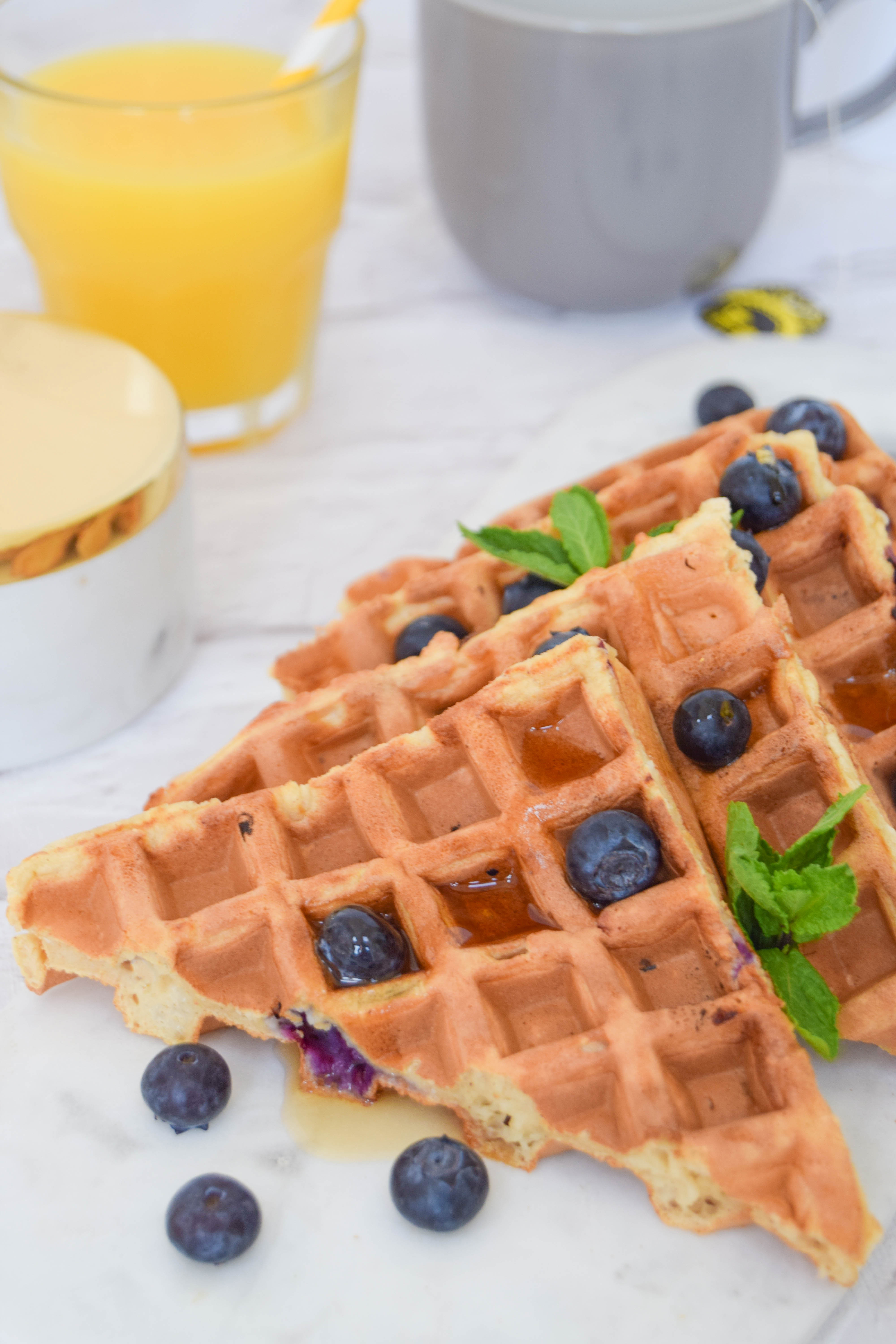 Fluffy waffles bursting with juicy blueberries for the ultimate weekend brunch. Fluffy waffles bursting with juicy blueberries for the ultimate weekend brunch.