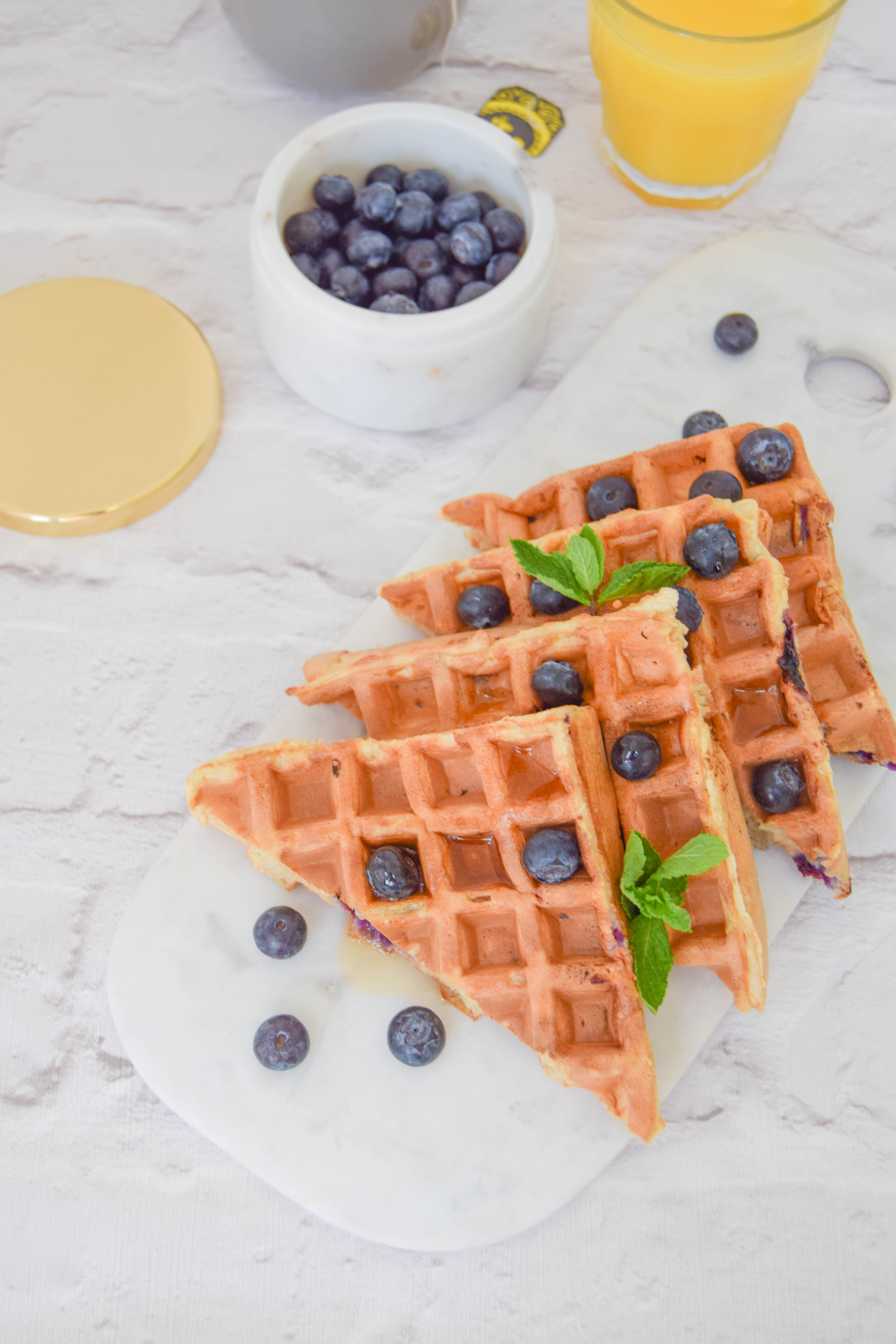 Fluffy waffles bursting with juicy blueberries for the ultimate weekend brunch. 