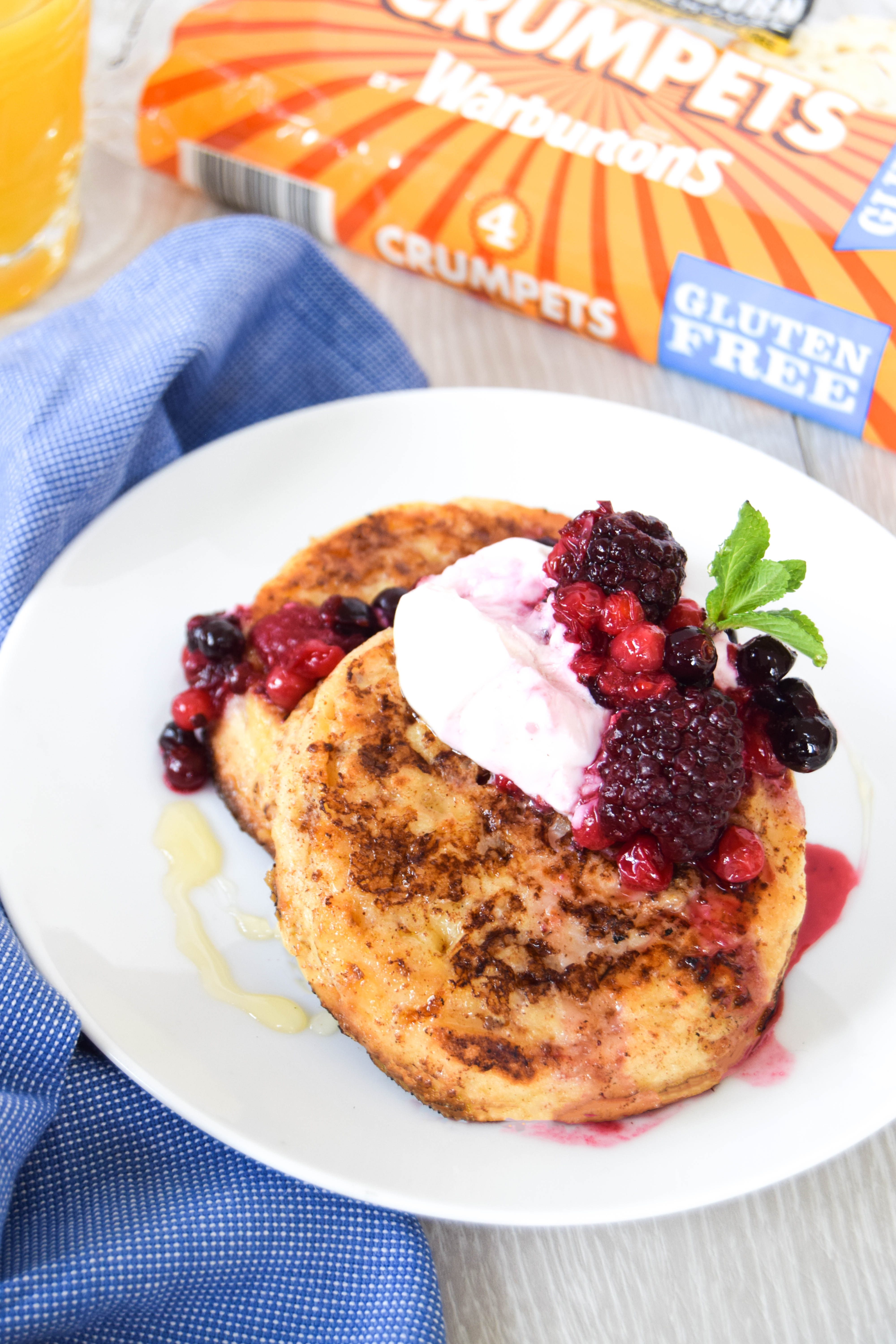 Delicious gluten free eggy crumpets spiked with cinnamon and topped with an easy berry sauce.