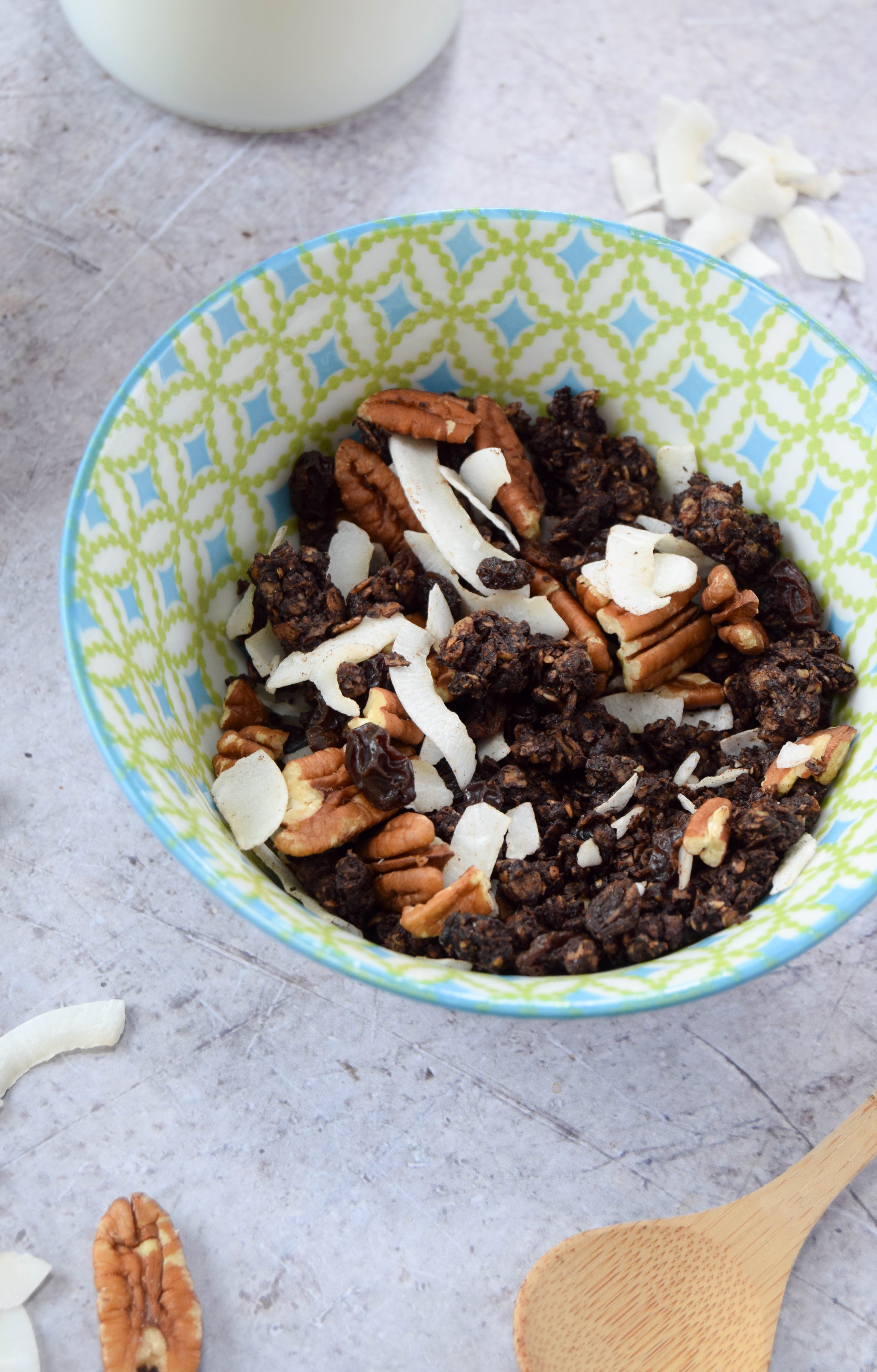 Chocolate for breakfast? Yes please! Get your morning chocolate fix with this healthier chocolate granola recipe with coconut and pecans.