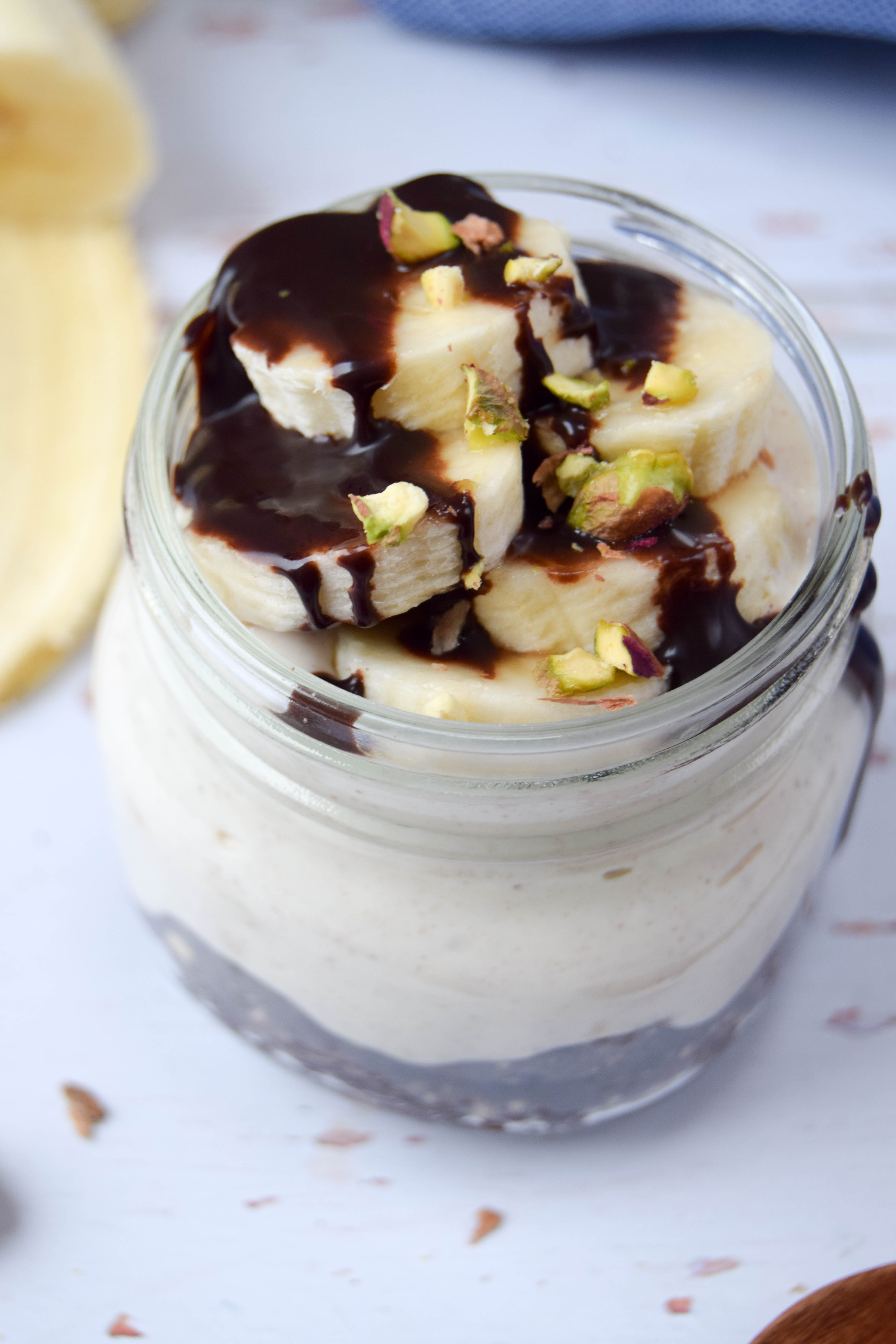 A healthier parfait dessert, made with a chocolate cookie base, creamy peanut butter filling and topped with chopped banana.