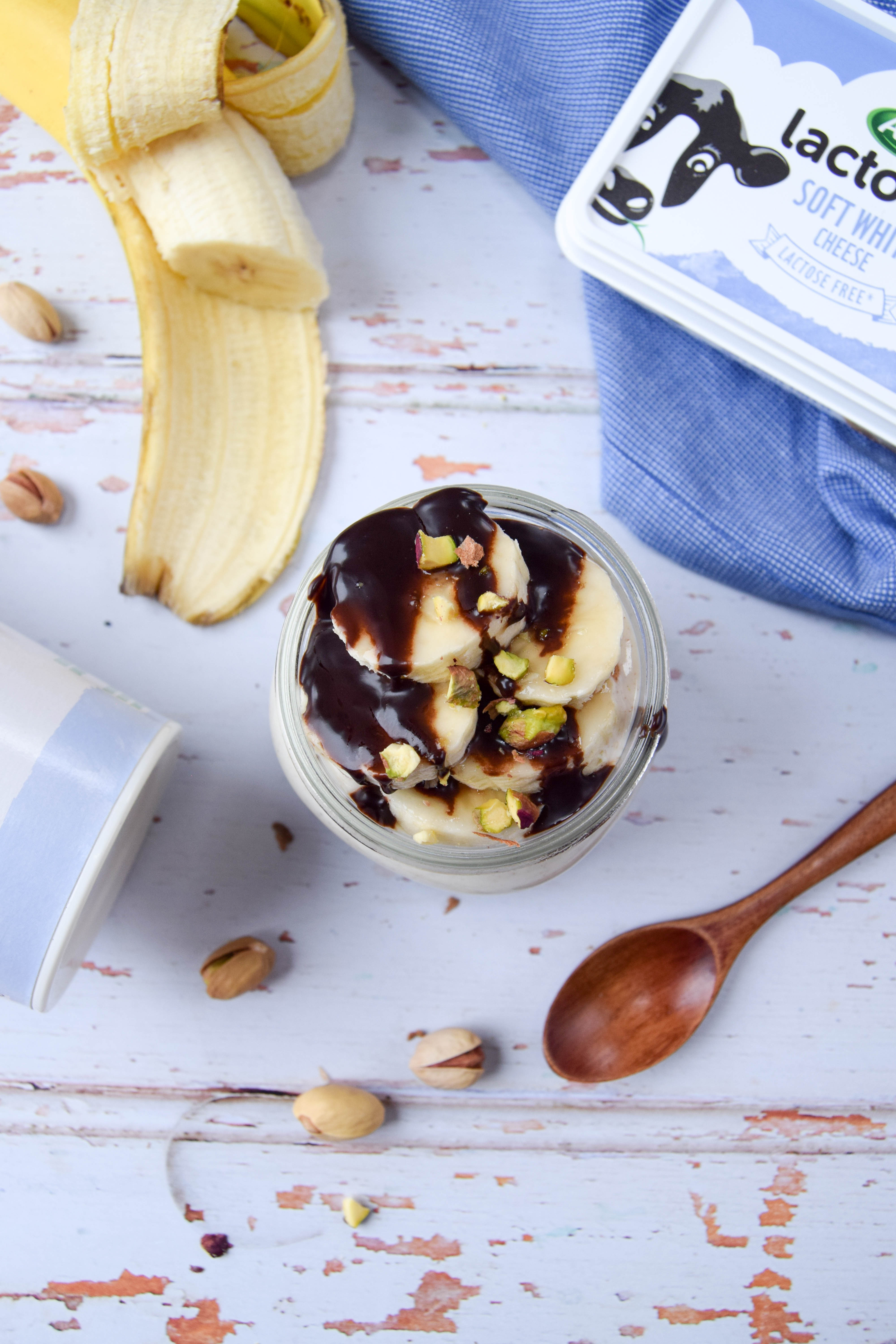 A healthier parfait dessert, made with a chocolate cookie base, creamy peanut butter filling and topped with chopped banana.