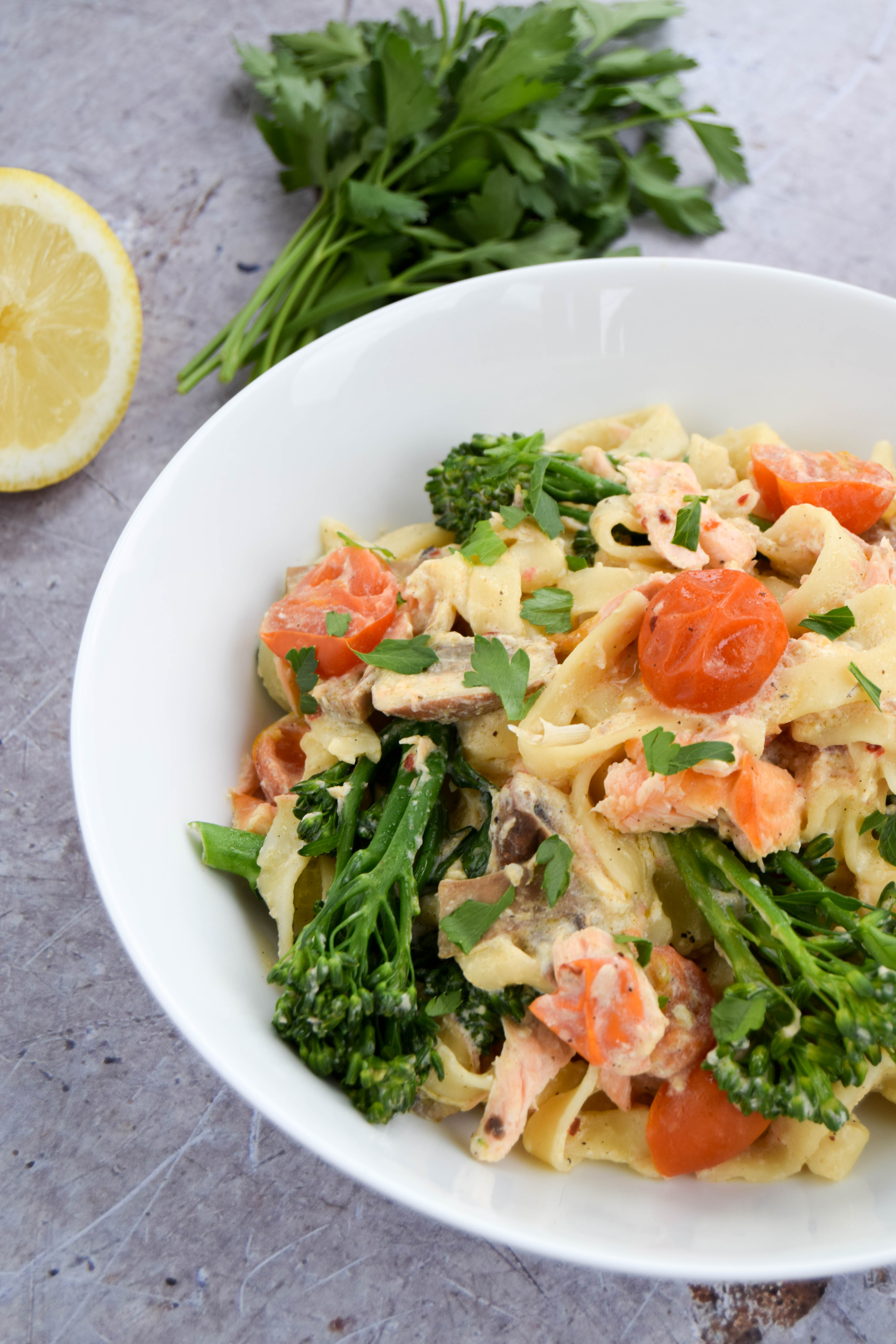 A summery pasta dish made with salmon and tenderstem broccoli and a creamy sauce made with quark. 
