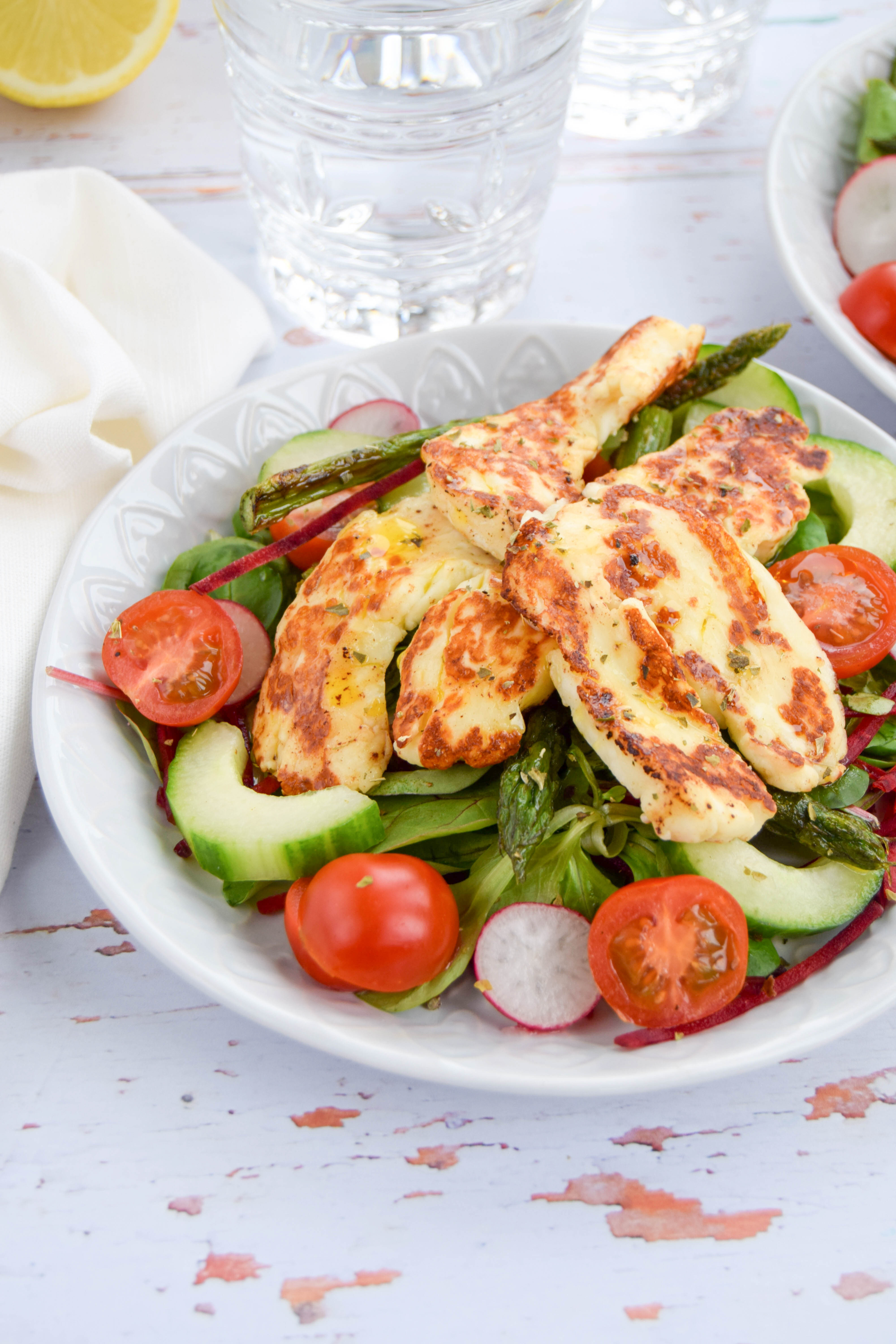 Seasonal British asparagus teamed up with salty halloumi cheese to create a vibrant and fresh summery salad. 