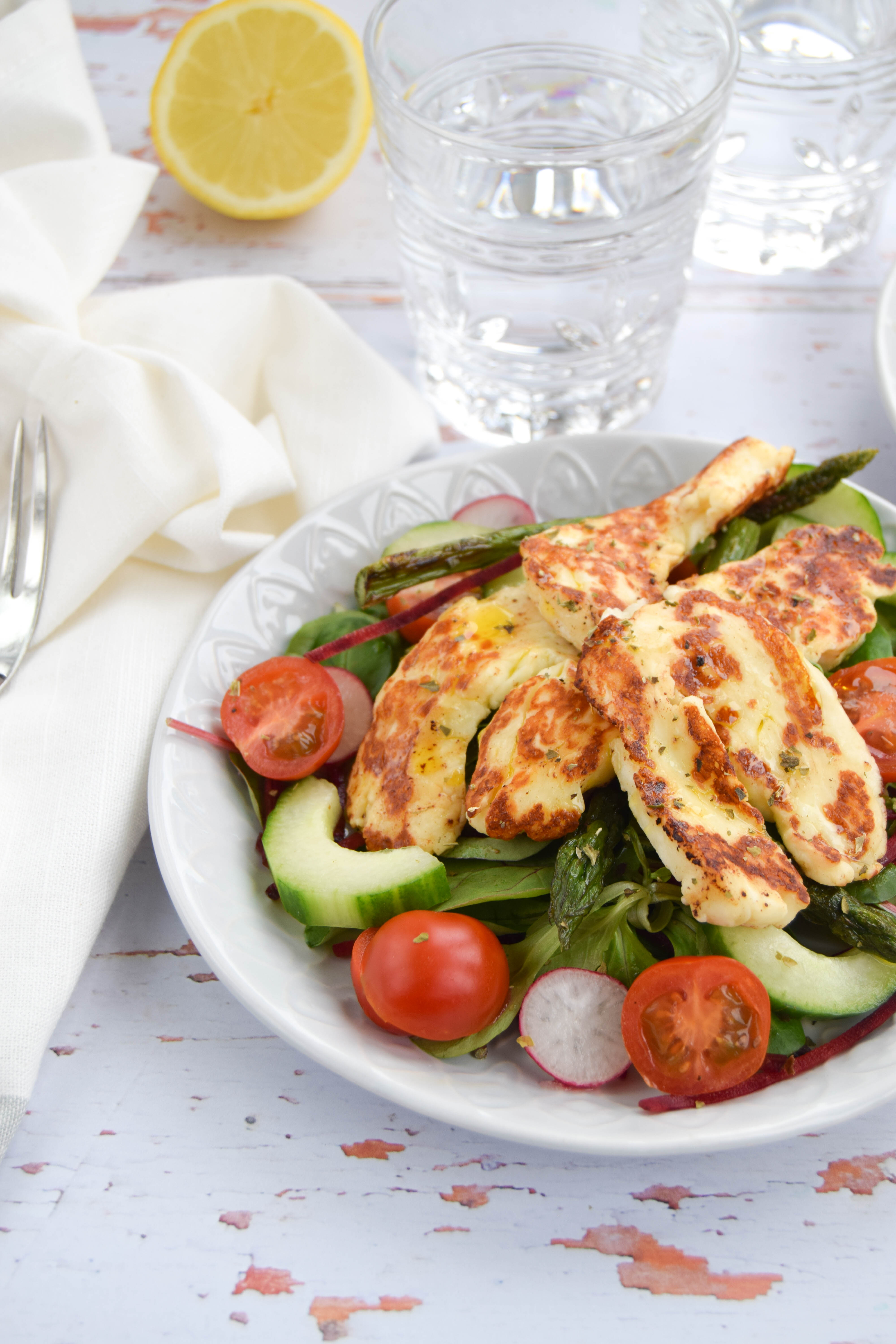 Seasonal British asparagus teamed up with salty halloumi cheese to create a vibrant and fresh summery salad. 