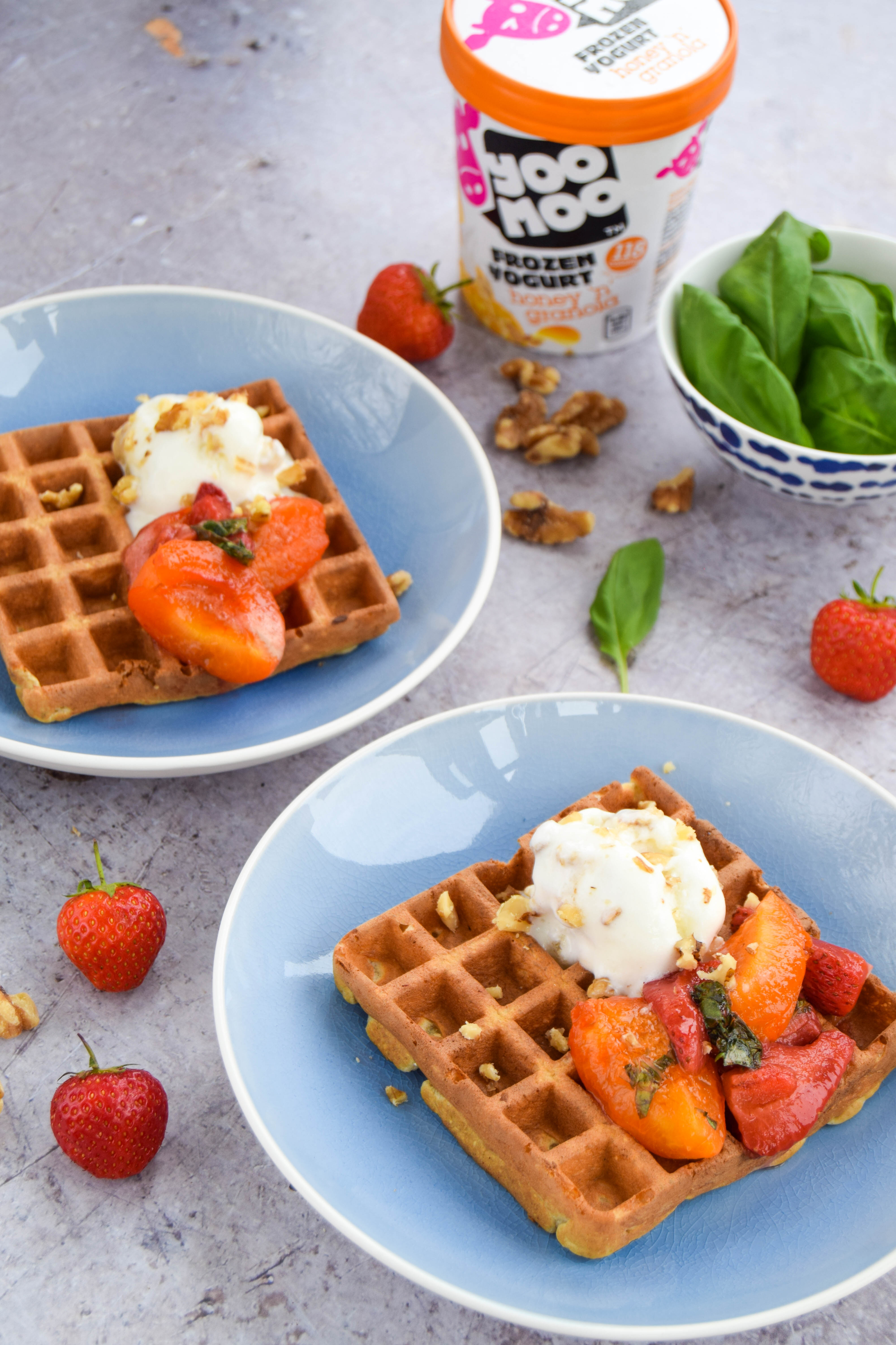Enjoy fresh fruit to start your day? Catch up with friends with these oat waffles topped with an apricot sauce made with softened apricots, strawberries, and basil.