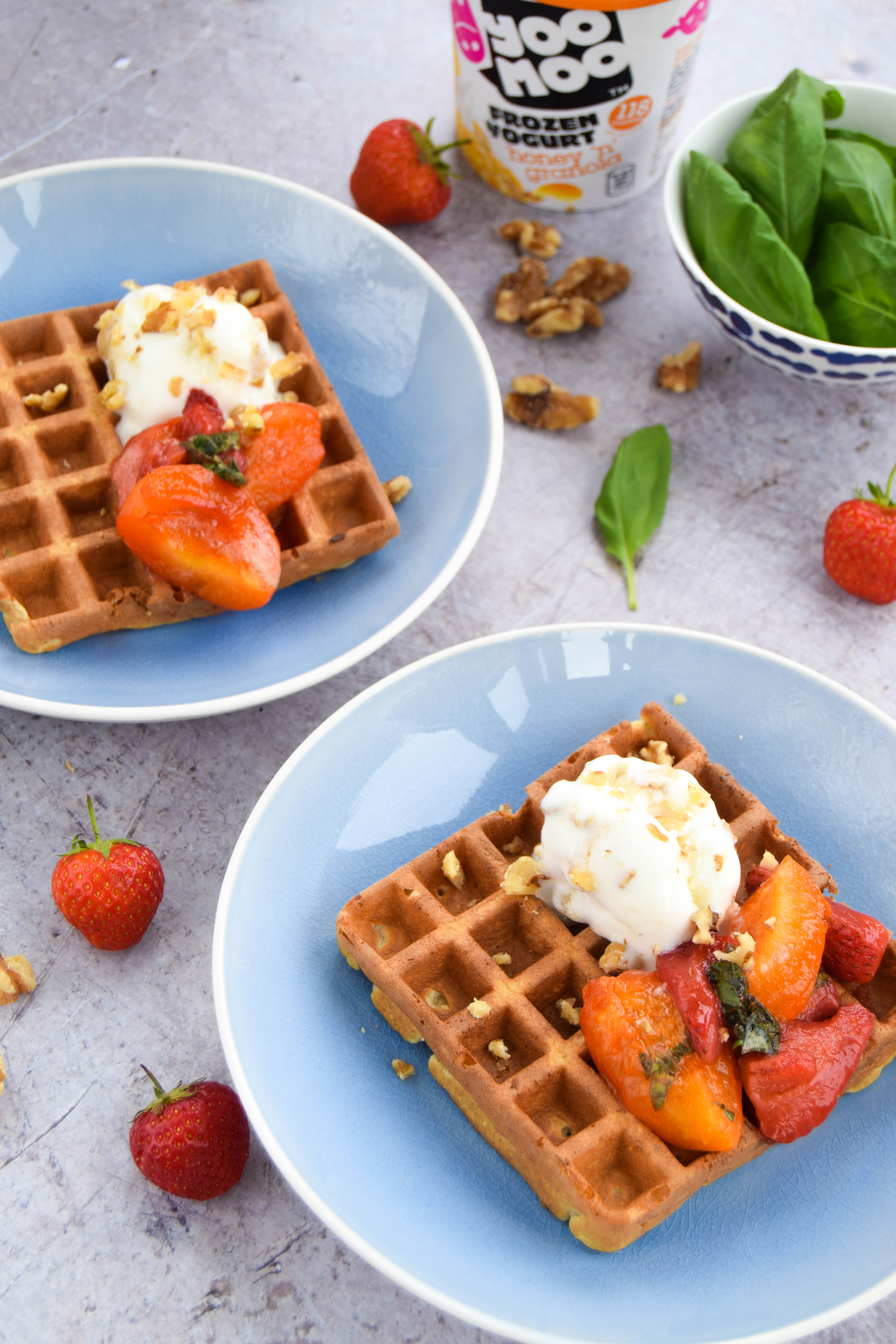 Enjoy fresh fruit to start your day? Catch up with friends with these oat waffles topped with an apricot sauce made with softened apricots, strawberries, and basil.