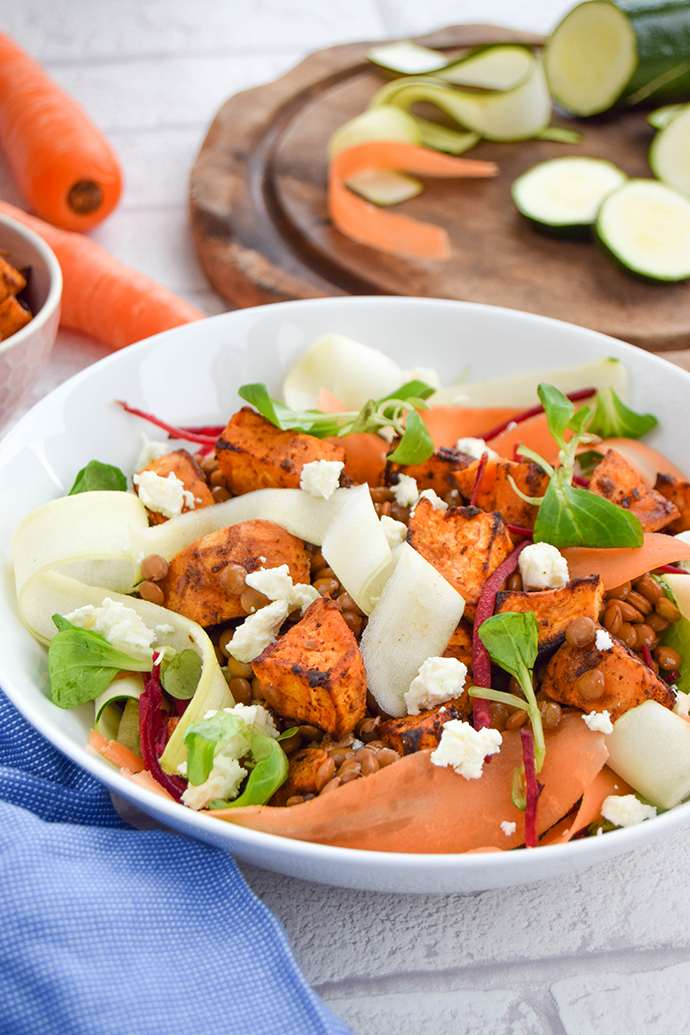 Are you stuck in a lunch time food rut? Change things up with this wholesome lentil ribbon salad with feta and ras el hanout sweet potatoes.