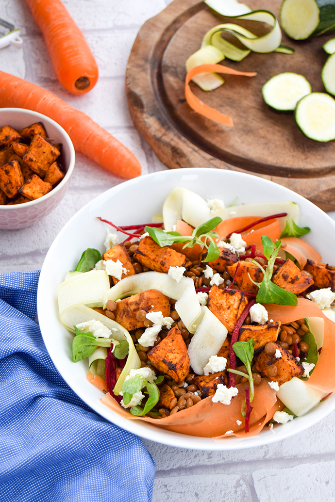 Are you stuck in a lunch time food rut? Change things up with this wholesome lentil ribbon salad with feta and ras el hanout sweet potatoes.
