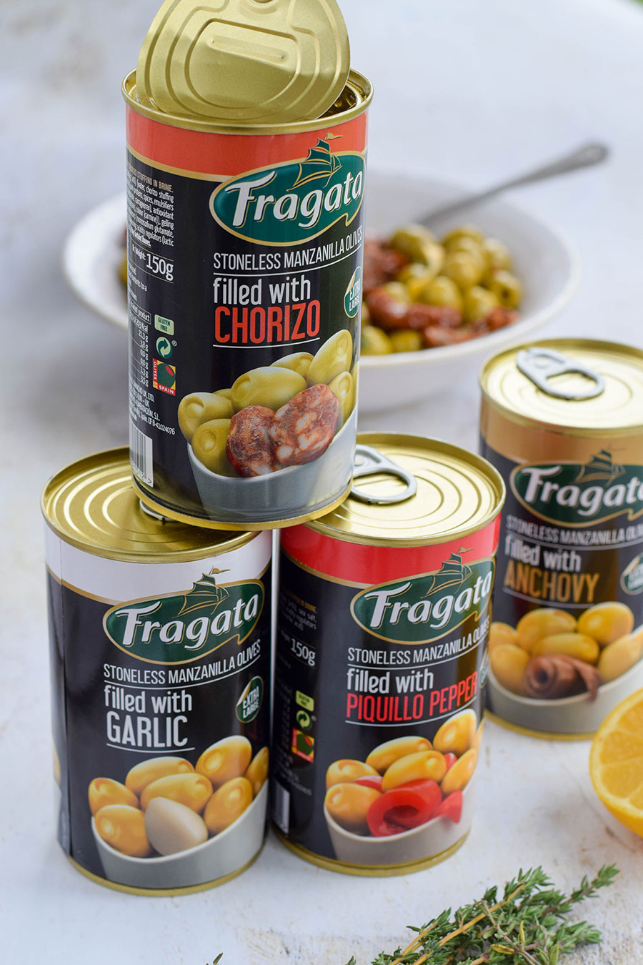 Delicious green Manzanilla olives filled with chorizo and garlic marinated with lemon, thyme, and sundried tomatoes.