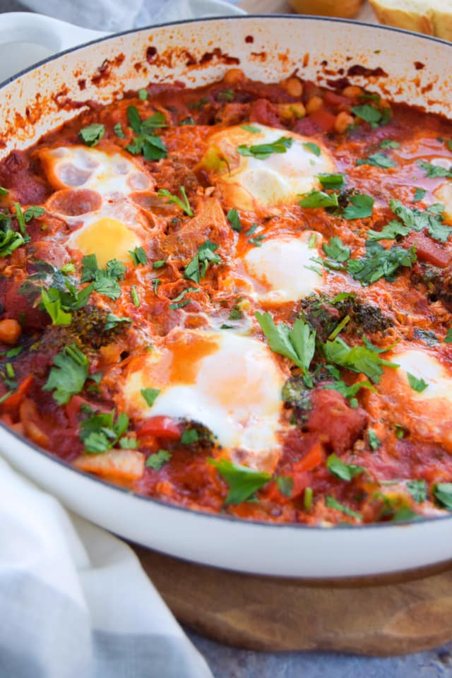 Dive into this vegetable packed&nbsp;shakshuka&nbsp;recipe that is mildly spiced with delicious North African flavours like harissa.&nbsp; It's a great one to create for a special brunch when friends and family come over.&nbsp; Serve it in the pan and let everyone tear off some crusty bread and dig into those runny egg yolks and tomato stew.&nbsp;