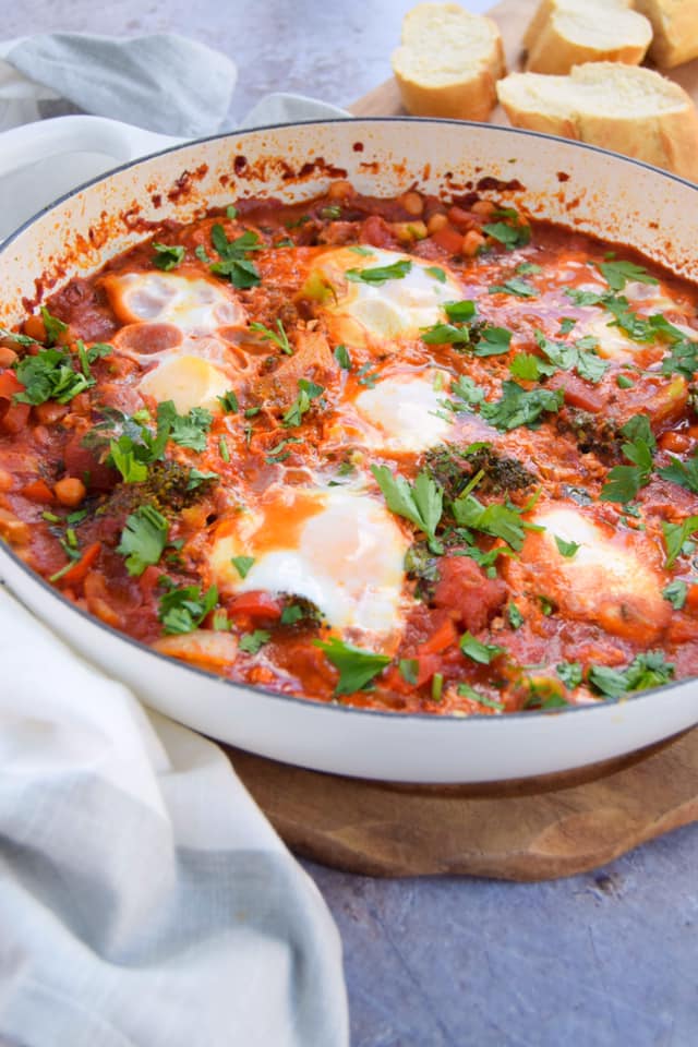 Dive into this vegetable packed&nbsp;shakshuka&nbsp;recipe that is mildly spiced with delicious North African flavours like harissa.&nbsp; It's a great one to create for a special brunch when friends and family come over.&nbsp; Serve it in the pan and let everyone tear off some crusty bread and dig into those runny egg yolks and tomato stew.&nbsp;